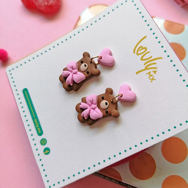 Aretes osos con moño rosa