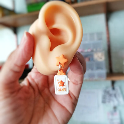 Aretes recortes del kinder naranjas